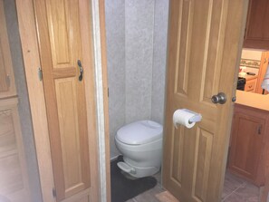 Bathroom area next to the master bedroom and up two steps from kitchen.