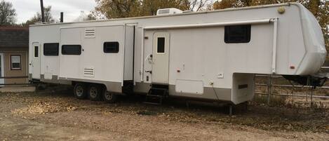 45’ Toy hauler camper with three slide outs.