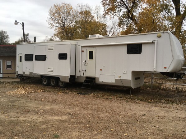 45’ Toy hauler camper with three slide outs.