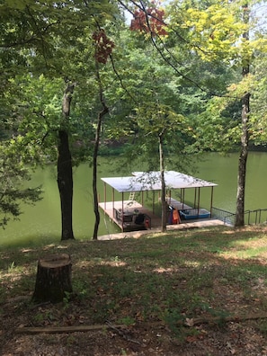 Boathouse protected from the wind and waves of the big river.