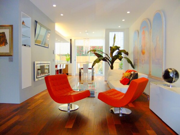 Family space featuring large TV and fireplace
