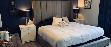 King size bed with personal bathroom, coffee bar, writing desk, refrigerator 