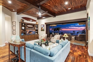 Main Living Area: Acacia wood floors and ceilings, mahogany finishes, and elegant island-inspired décor.