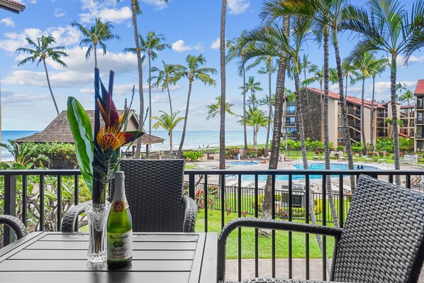 This private balcony is the perfect spot to unwind with a glass of wine while soaking in the stunning ocean and sunset views over Maui's coastline.