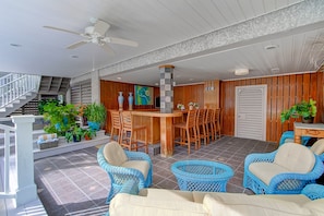 pool side lanai with hot tub and bar area