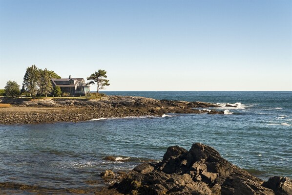 A view of the home from Shore Road exhibiting the peninsula on which it is located.