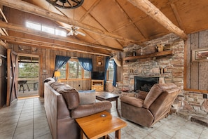 Living room features sleeper sofa, 2 recliners, large gas fireplace, Roku TV