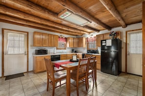Large kitchen includes full size fridge, electric range, dishwasher & microwave