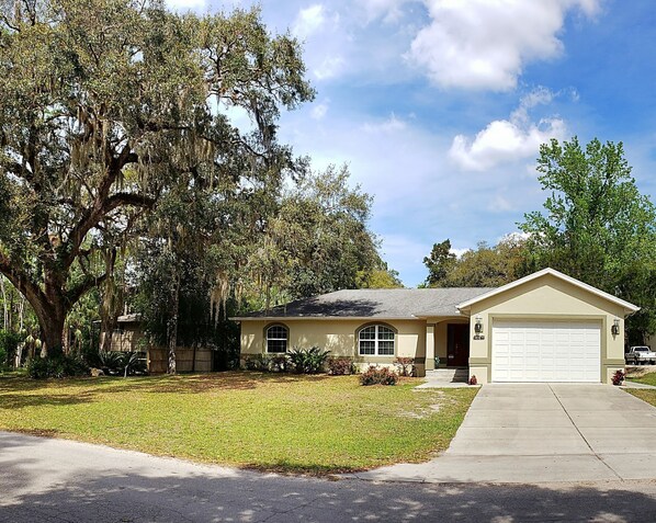 Front of home showing the huge oak tree