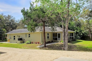 House from the side and the rear screened patio
