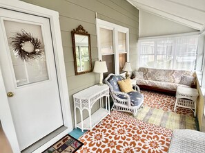 Spacious front porch has plenty of room to hang out and relax. 