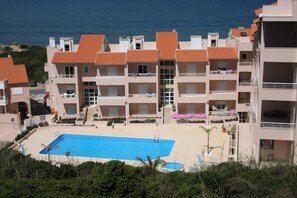 Pool terrace and sea beyond.