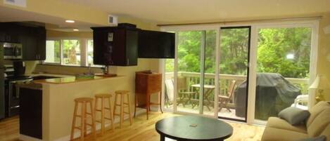 Open kitchen, dining & living area w/ balcony, HD TV, cable, DVD player & Wi-Fi