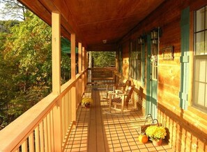 Morning sun on the large covered front porch with rockers and porch swing