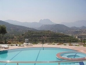 Infinity pool with mountain views