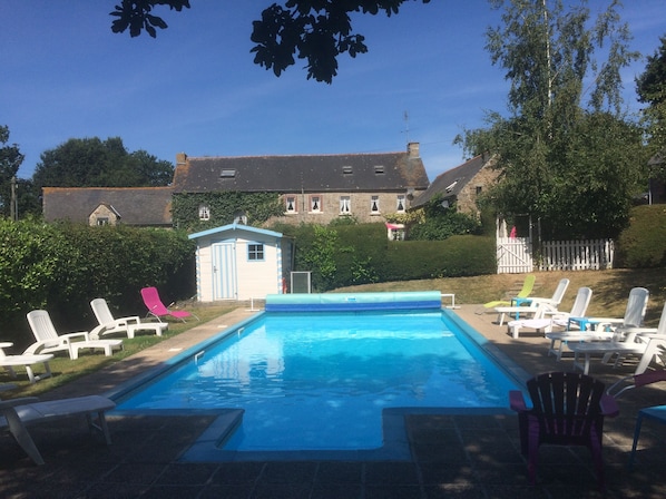 Heated Swimming Pool with Owners House & Gites in Background.