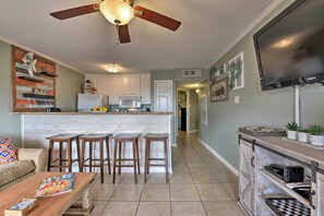 The spacious interior sleeps 6 guests and offers beach-themed decor.