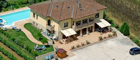 Aerial view showing large size of villa, large pool & huge parking area