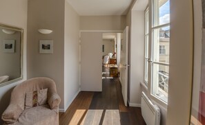 Entry hall with toilets. Access to open space of 970sqf