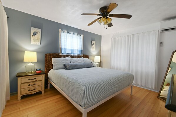 Comfy king bed, TV, closet, dresser, nightstands, ceiling fan and AC.