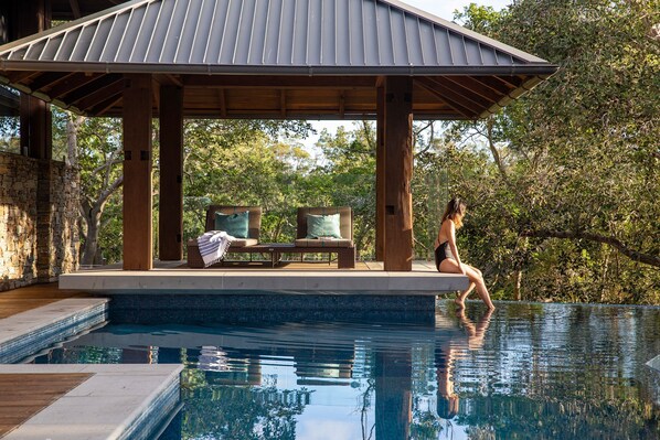 the infinity pool and its cabana