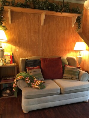A nice place to sit in front of the wood burning stove.