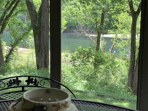 Screened in porch is a great place to enjoy lunch or morning coffee.