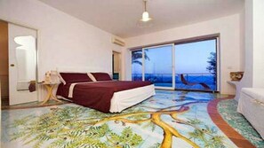 Bedroom with air conditioning, private bathroom with shower, terrace ocean view