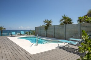 Pool and deck with ocean views