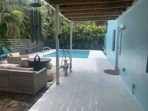 Gas fire pit seating with pool. 