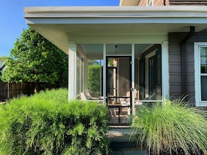 The screened-in porch on a summer day.