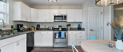 Cook all your favorite meals in the newly updated kitchen complete with new cabinets, granite countertops, and deep sink.