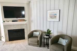 Flat screen TV and cozy fireplace