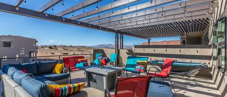 Upstairs Patio - Large deck has a great view, plenty of seating, two hammocks and a gas fire pit.