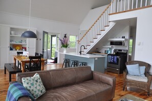 Main floor kitchen, dining, and sitting area