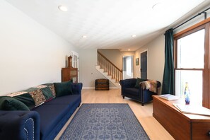 Living Room showing stairs to upper level