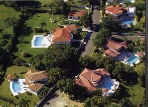 The villas sit on the hillside, above the resort