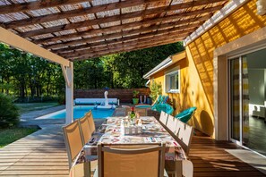 Large wooden terrace with private pool and outdoor table for 8 people