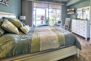 Coastal feel in king bedroom with nautical colors and accents.
