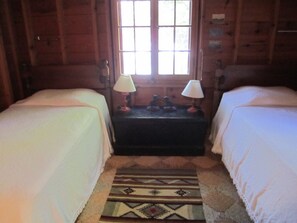 Two twin beds, with nice, big windows.