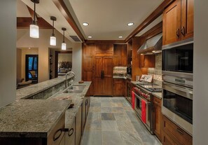 Chefs kitchen includes granite counters, Wolf oven, Sub Zero refrigerator + more