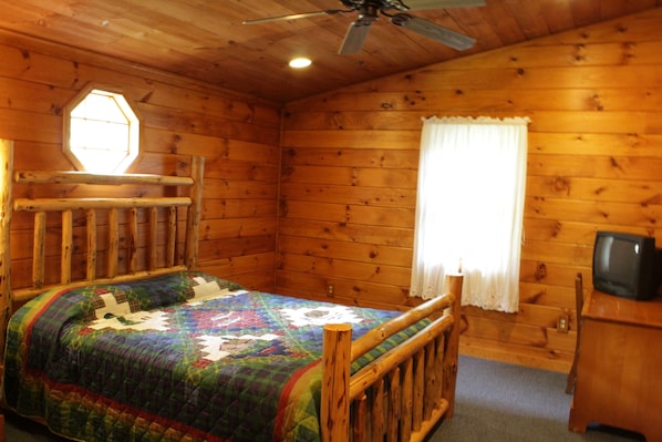 Large master bedroom with Queen hand-carved wood bed, big closet