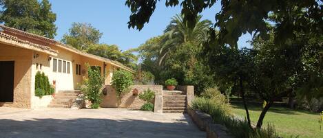 The private courtyard entrance to the  villa, pool and gardens