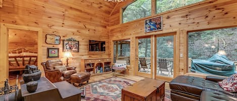 Gathering room with wood stove and flat screen HD TV with Netflix