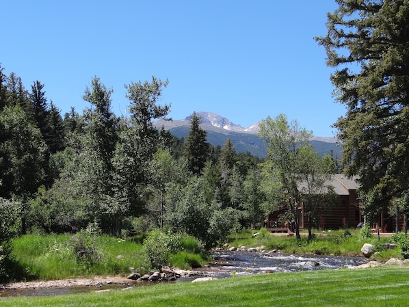 View from backyard, deck, and living room looking up river at Longs Peak