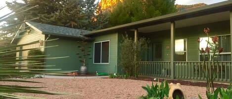 Front of home with Castle Rock glowing in the background.
