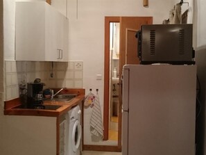 Small kitchen but has most things needed