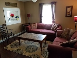 The Living Room with chair, Sofa, Loveseat, and 50" High Def TV