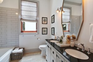 Upstairs bathroom, double vanity, tub and large walk-in shower.