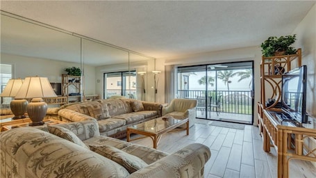 Bright and comfortable living room overlooking the beautiful Gulf views
